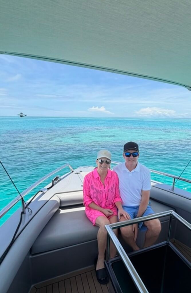 Mr. and Mrs. Willis smiling on a boat off the coast of Australia